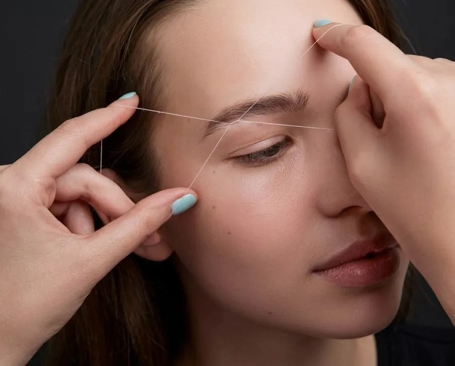 Expert eyebrow threading removes unwanted facial hair with precision at NY Brows